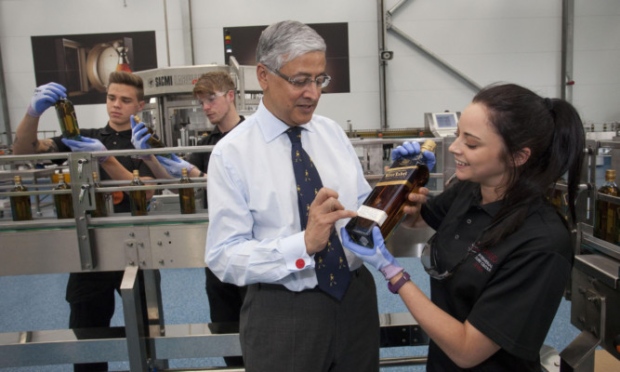 Diageo chief executive Ivan Menezes talks with apprentices during a visit to the Leven plant