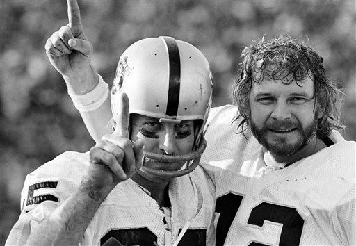 Oakland Raiders receiver Fred Biletnikoff left and quarterback Ken Stabler each hold up one finger after the Raiders defeated the Minnesota Vikings in the NFL football Super Bowl in Pasadena Calif