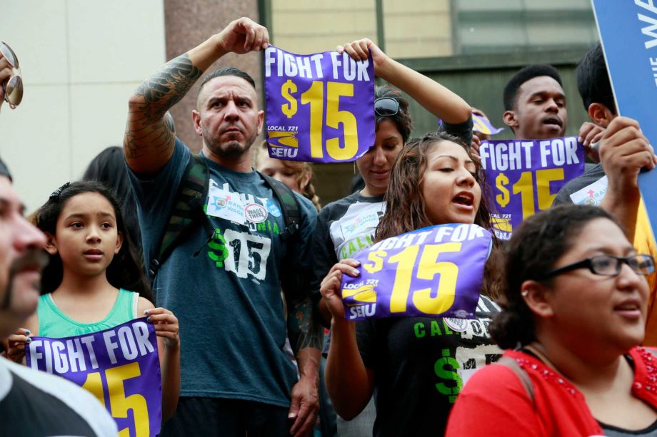 Workers hold a rally in support of the Los Angeles County Board of Supervisors proposed minimum wage ordinance in Los Angeles on Tuesday