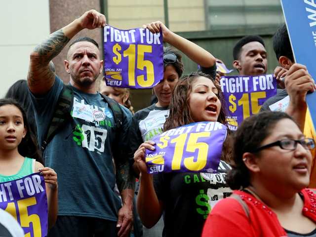 Workers hold a rally in support of the Los Angeles County Board of Supervisors&#39 proposed minimum wage ordinance in Los Angeles on Tuesday. Associated Press