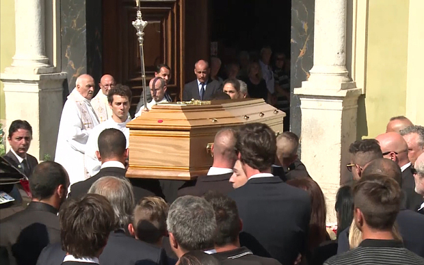 Jules Bianchi's coffin is carried into a church in Nice for the funeral ceremony