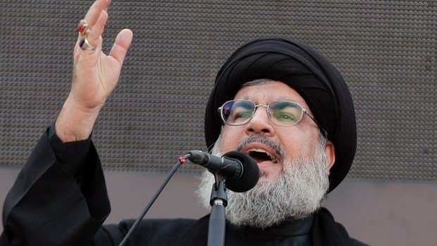 Hezbollah leader Sheik Hassan Nasrallah speaks to the crowd in a rare public appearance during Ashura which marks the death of Shiite Islam's Imam Hussein in the suburbs of Beirut Lebanon Thursday Nov. 14 2013