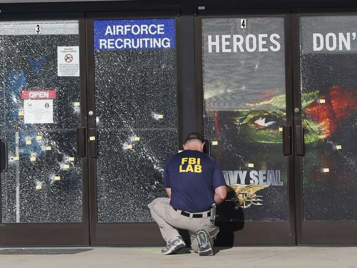 FBI investigator investigates the scene of a shooting outside a military recruiting center in Chattanooga Tenn. John Bazemore  AP file