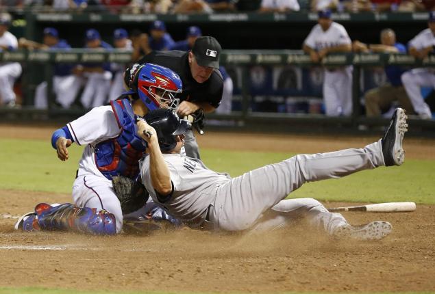 Mark Teixeira is thrown out at home plate after he says Yankees third base coach Joe Espada told him 'easy&#39 as he rounded third base