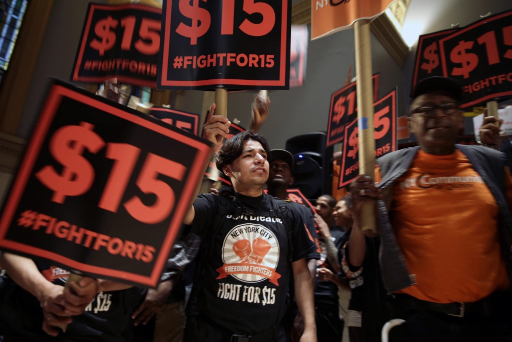 Demonstrators rally before a meeting of a state wage board in New York. On Wednesday a state panel recommended the minimum wage for fast-food employees be raised to $15 an hour bypassing the state legislature