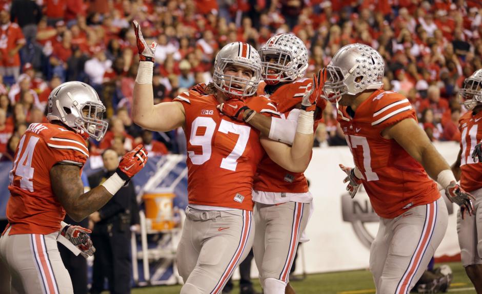 Sophomore defensive lineman Joey Bosa celebrates following a play during a game against Virginia Tech on Sept. 6 at Ohio Stadium. OSU lost 35-21. Credit Mark Batke