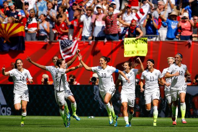 Members of the U.S. women's soccer team celebrate after Carli Lloyd scores a second goal Sunday. Social media users took to Twitter to bash Japan with Pearl Harbor references