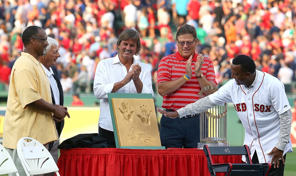 Hall of Famers Jim Rice Carl Yastrzemski Dennis Eckersley and Carlton Fisk present Pedro Martinez a cast of his hands during a ceremony in his honor at Fenway Park on Wednesday in Boston Massachusetts