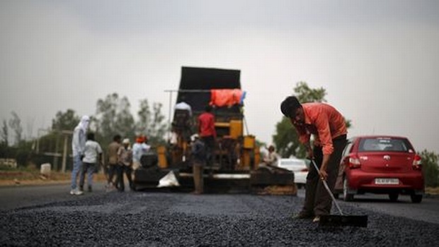 A labourer works at the construction site of the Delhi Jaipur national highway in Manesar in Haryana | File  Reuters