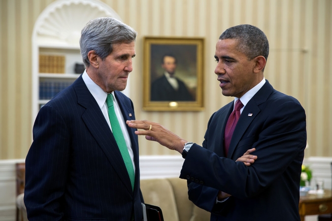 President Barack Obama talks with Secretary of State John Kerry in the Oval Office Nov. 1 2013