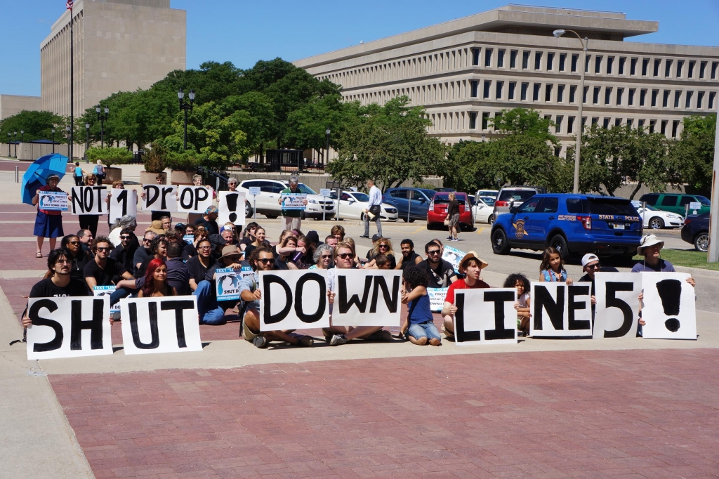 Protesters rallied at the state Capitol on Thursday demanding that an oil and gas pipeline under the Straits of Mackinac be shut down