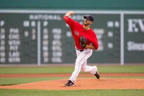 BOSTON MA- JULY 24 Rick Porcello #22 of the Boston Red Sox throws a pitch during the first inning against the Detroit Tigers at Fenway Park