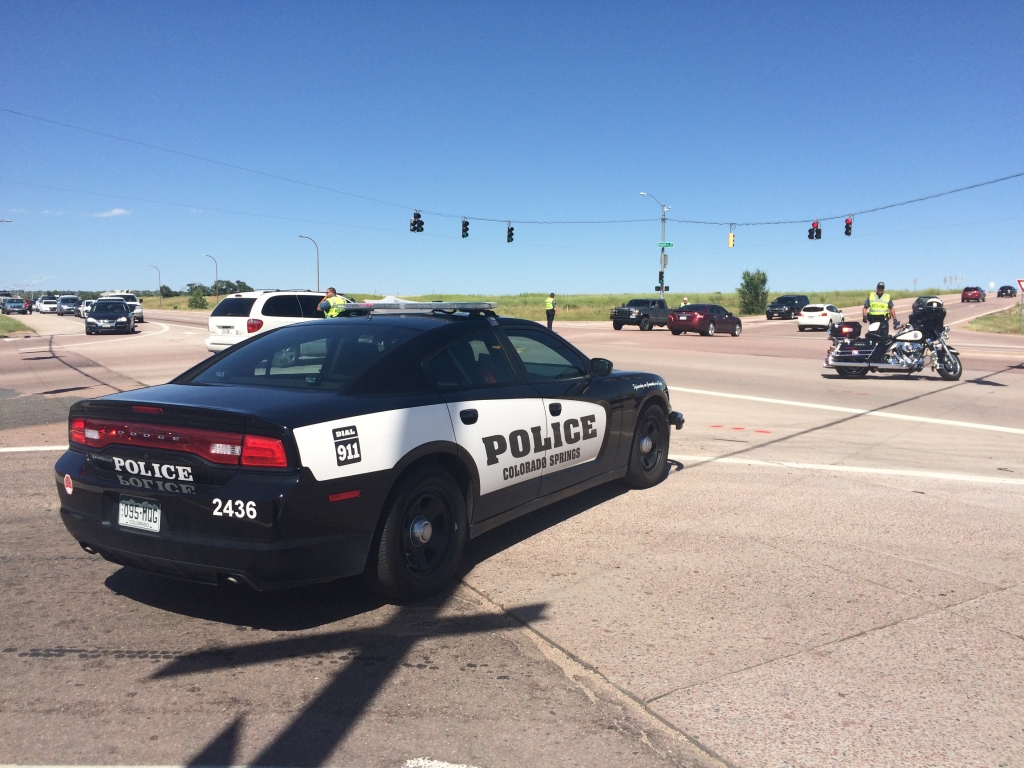 A Colorado Springs police car blocks traffic on Powers Boulevard Tuesday afternoon. The road was closed due to police activity in the area.  Mike Duran- FOX21 News