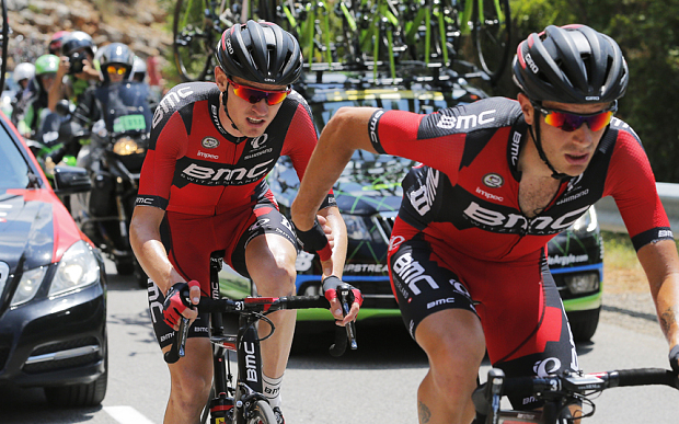 Tejay van Garderen is helped by a teammate after falling ill on the Tour de France