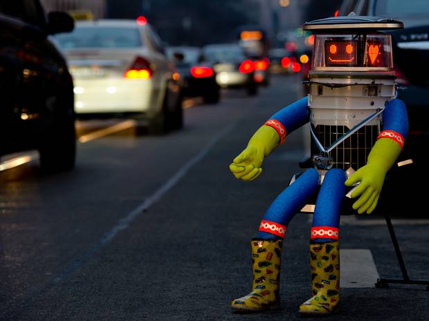 The adorable HitchBOT patiently waiting for its next travel companions