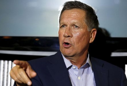 Republican Ohio Governor John Kasich gestures at a news conference in Washingt