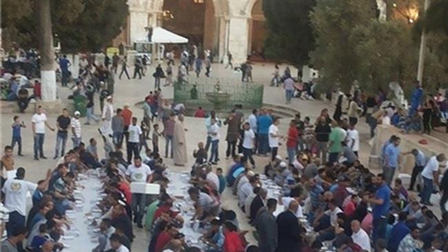 Palestinians break their fast in the premises of al Aqsa mosque