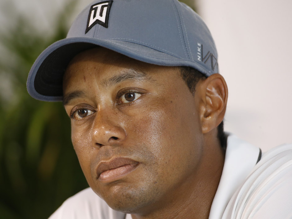 Tiger Woods listens to a question during a news conference prior to the start of the Quicken Loans National golf tournament. This event is likely the second last event of the season for Woods