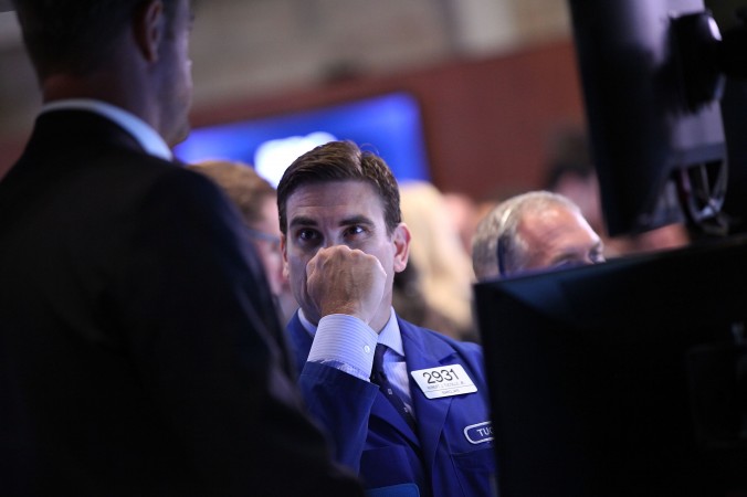 Traders work on the floor of the New York Stock Exchange