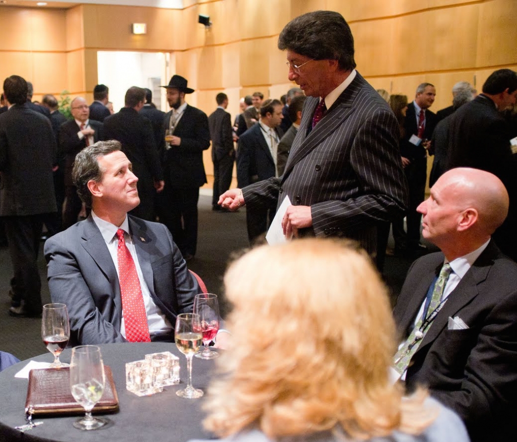 Presidential candidate Rick Santorum and GOP operative Michael Glassner talk to some guy with great hair and a pinstripe suit at the Republican Jewish Coalition meeting in Washington DC in 2012