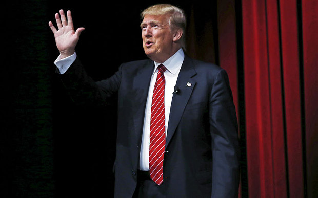 U.S. Republican presidential candidate Donald Trump arrives to speak at the Family Leadership Summit in Ames