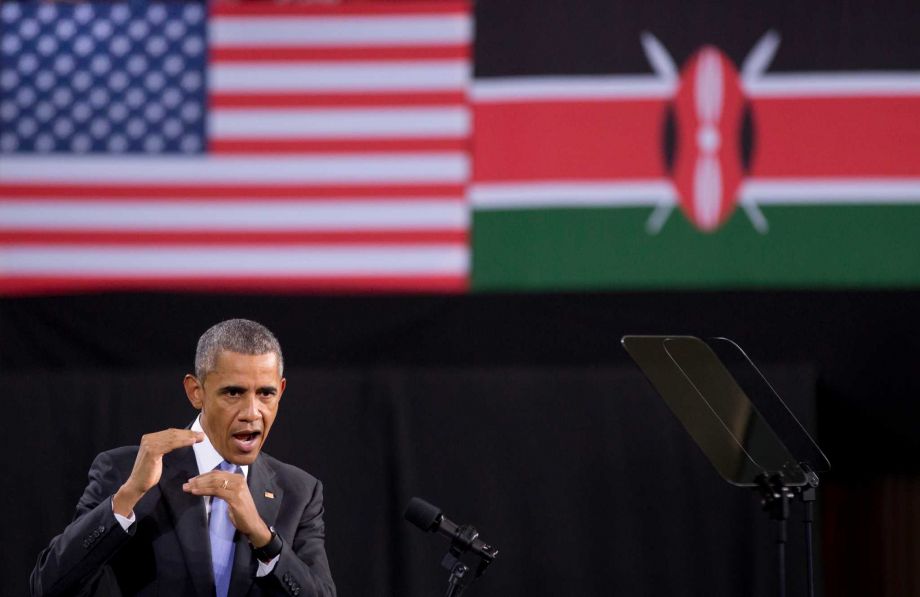 President Barack Obama delivers a speech in front of American and Kenyan flags at the Safaricom Indoor Arena in the Kasarani area of Nairobi Kenya Sunday