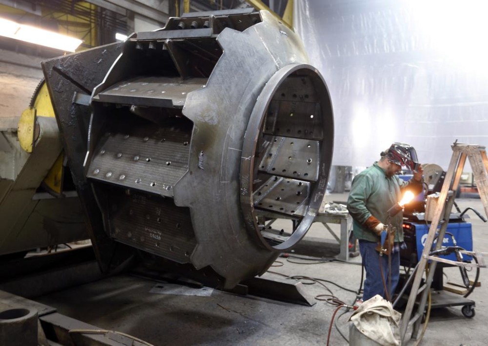 Feb. 12 2015 a man welds parts in fans for industrial ventilation systems at the Robinson Fans Inc. plant in Harmony Pa. The Commerce Department releases second-quarter gross domestic product on Thursday