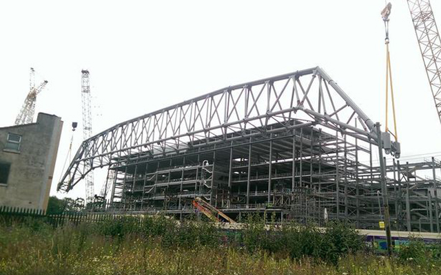 Main Stand roof truss starts its rise to the top of Anfield