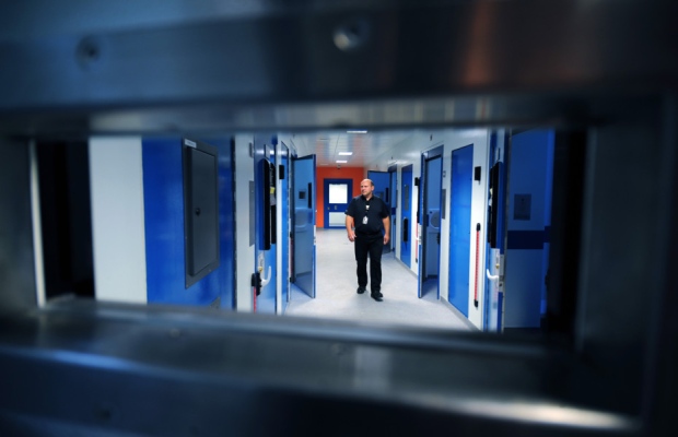 West Yorkshire Police's Leeds District Headquarters on Elland Road Leeds. Custody Sergeant Simon Carbutt checks the new cells. 11th April 2014. JG100268c