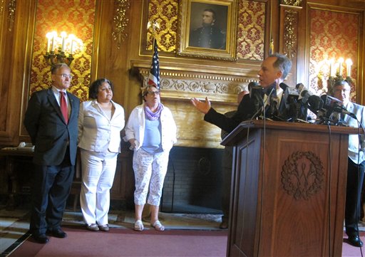 Republican Assembly Speaker Robin Vos right motions to Democratic Reps. from left Peter Barca Jo Casta Zamarripa and Christine Sinicki at a news conference to announce a bill to pay for a new $500 million Milwaukee Bucks arena will pass on Tuesday Ju