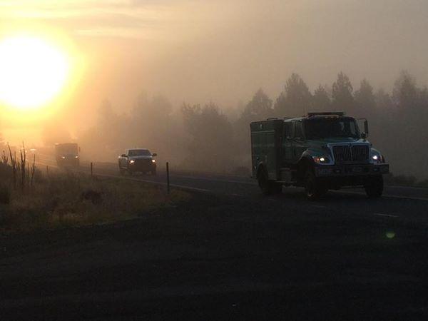 A USFS procession leaves the Frog Fire headed for Redding with the body of fallen firefighter David Ruhl