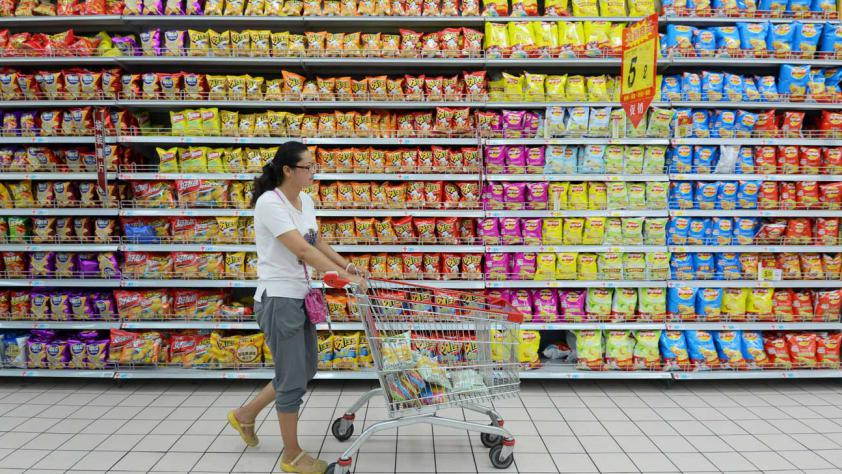 A customer pushes a cart at a supermarket in Anhui province China. Reuters