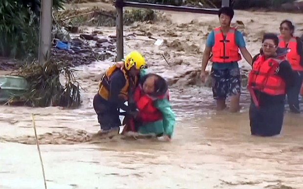 A man is rescued from fast-flowing water