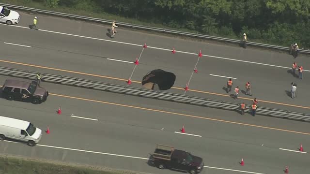 A sinkhole opened up in the northbound lanes of Interstate 93 in Concord N.H. Wednesday Aug. 19 2015