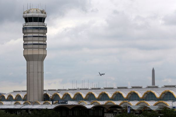 An airplane flies between the air traffic control