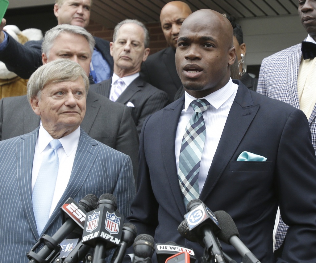 Minnesota Vikings running back Adrian Peterson right had his probation in Montgomery county terminated more that a year early