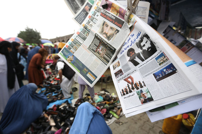 Newspapers hang for sale at a stand carrying headlines about the new leader of the Afghan Taliban Mullah Akhtar Mohammad Mansoor in Kabul Afghanistan Saturday Aug. 1 2015. The new leader of the Afghan Taliban vowed to continue his group's bloody