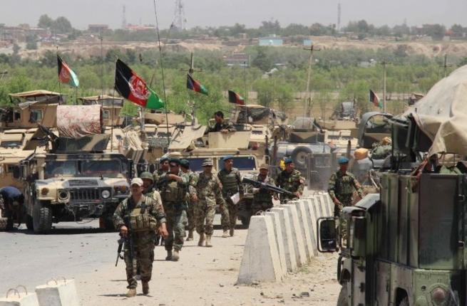 Afghan troops walk in the Chardarah district of Kunduz province