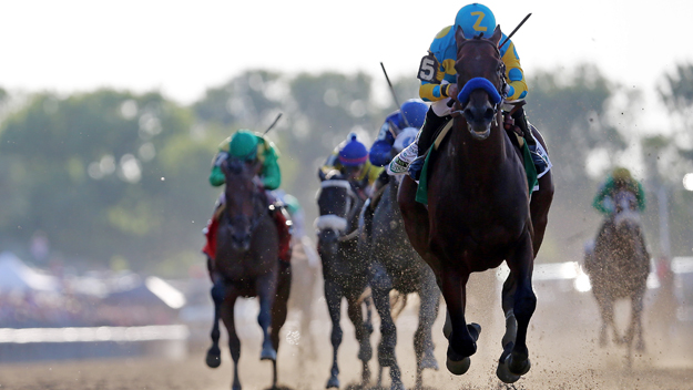 American Pharoah ridden by Victor Espinoza pulls away and wins the 147th running of the Belmont Stakes