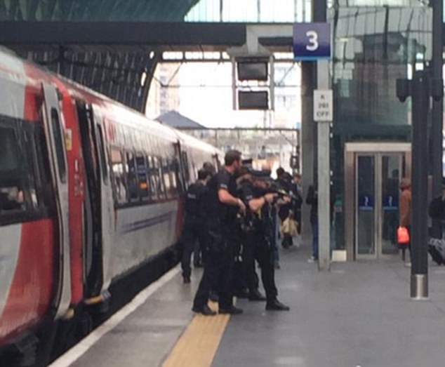 Armed police officers arrested a 40-year-old man in a raid on King's Cross Station this afternoon