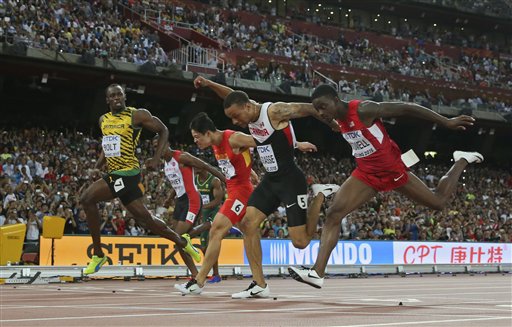 Jamaica's Usain Bolt front competes in a mens 100m semifinal at the World Athletics Championships at the Bird's Nest stadium in Beijing