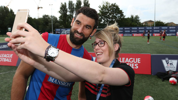 Mile Jedinak with a fan ahead of the new EPL season