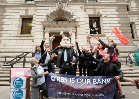 Britain's Chancellor George Osborne is the target of protester's ire at a protest against the UK government's RBS shares sell-off