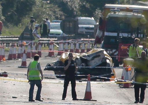 Emergency services attend the scene on the A27 after a plane crashed into cars on the major road during an aerial display at the Shoreham Airshow in West Sussex England