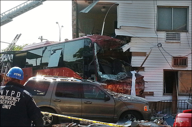 6 hurt as bus shears off chunk of 3-story building in NYC