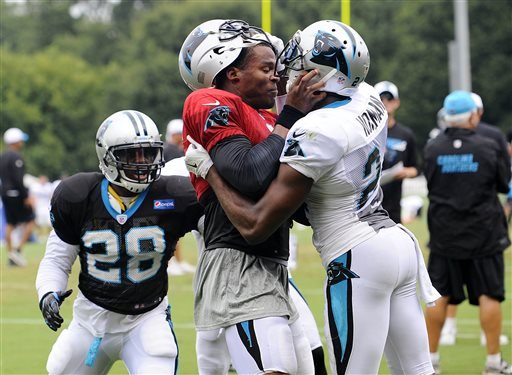 Carolina Panthers Cam Newton and Josh Norman scuffle at the teams NFL football training camp at Wofford College in Spartanburg S.C. Monday Aug. 10 2015.  MAGS OUT TV OUT MANDATORY CREDIT