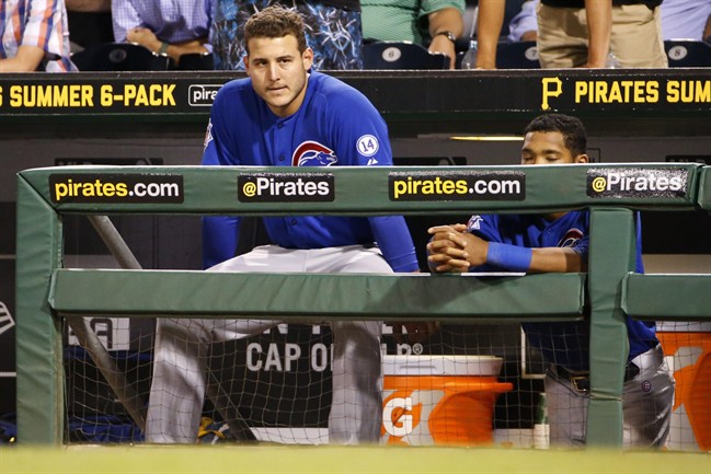 Chicago Cubs Anthony Rizzo left and Addison Russell watch from the dugout as Dexter Fowler strikes out against Pittsburgh Pirates relief pitcher Mark Melancon to end a baseball game in Pittsburgh Wednesday Aug. 5 2015. The Pirates won 7-5. (AP