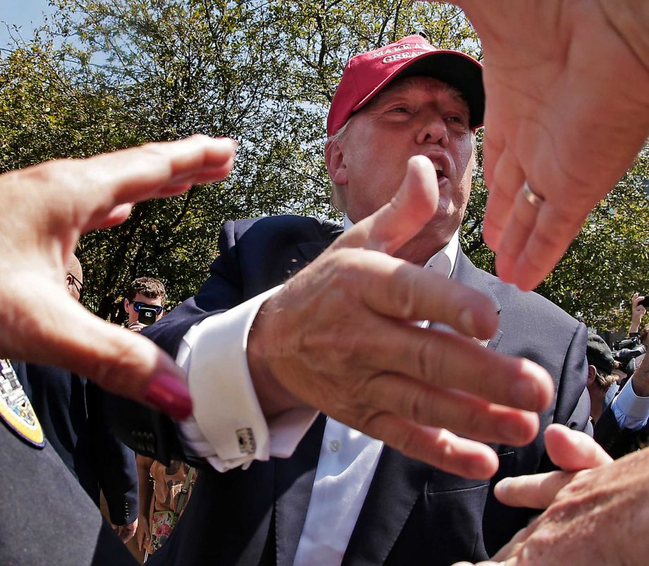 Republican presidential candidate Donald Trump greats the crowd at the Iowa State Fair Saturday Aug. 15 2015 in Des Moines