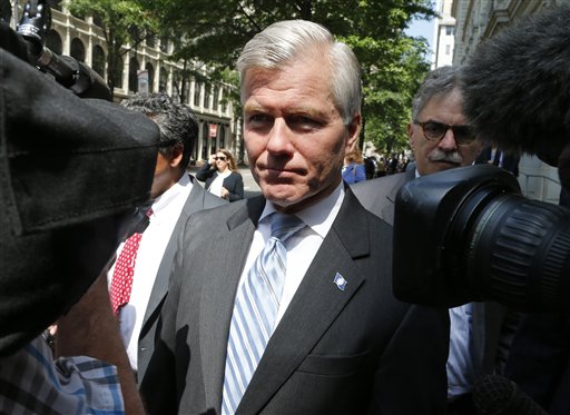 Former Virginia Gov. Bob Mc Donnell navigates a group of cameras as he leaves the 4th U.S. Circuit Court of Appeals after a hearing the appeal of his corruption conviction in Richmond Va. A federal appeals