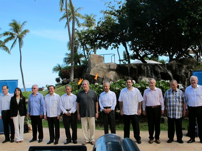 Trade ministers from 12 Pacific Rim nations negotiating the Trans Pacific Partnership agreement pose for a group